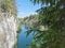 Top view of the cliffs, grotto and boats floating in the turquoise waters of Marble Canyon in Ruskeala Mountain Park on a summer d
