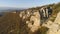 Top view of cliffs in morning sun. Shot. Picturesque panorama of rock and horizon of mountains with blue sky. Beautiful