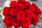 Top view of close up bouquet of red roses in selective focus at some romantic event like wedding bithday or engagement