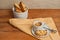 Top view, close up of homemade, freshly baked, apricot walnut biscotti and cup of espresso