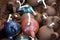 Top view closeup of multiple candle souvenirs in clay pitchers in a basket