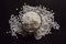 Top View of Closeup Pearls or white sago seeds balls in a Transparent Glass Bowl On isolated Black Background