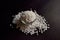 Top View of Closeup Pearls or white sago seeds balls in a Transparent Glass Bowl On isolated Black Background