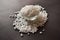 Top View of Closeup Pearls or white sago seeds balls in a Transparent Glass Bowl On isolated Black Background