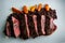 top view closeup tasty barbecued sliced meat with rice and carrot