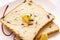 Top view closeup of two pieces of toast bread with a piece of sliced orange on top