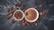 Top view of cocoa powder and chocolate chips in white bowls and whole cocoa beans with spices