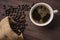 Top view /Coffee cup and coffee beans on wooden table