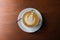 Top view of coffee latte art on wooden table