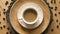 Top view of coffee with milk on decorative plate on wooden table