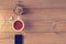 Top view of coffee, mobile phone and cactus on a wooden background