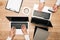 Top view of colleagues using laptops with credit card on table