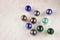 Top view of collection of shiny marbles on wooden background