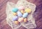 Top view of colorful easter eggs on cloth, retro filter effe