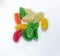 Top view of colorful Jujubes candies on white background