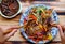 Top view colorful plate of food, vegan mixed vermicelli with vegetables