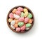 Top view of colorful sugared peanuts in wooden bowl