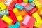 Top view of colorful wooden bricks on the table. Early learning. Educational toys on a orange background
