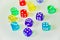 Top view of colourful dices in white background