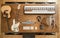 Top view of a composition of musical instruments on a wooden table in a recording studio. Musician`s workplace for creativity