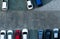 Top view concrete car parking lot. Aerial view of car parked at car parking area of apartment. Outdoor parking space with empty