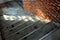 Top View of Concrete Stair with Brick Wall and Light on Ground.