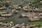 Top view of congested houseboats, shikara, boats, and houses in blue waters of Dal Lake. Jammu and Kashmir, India