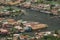 Top view of congested houseboats, shikara, boats, and houses in blue waters of Dal Lake. Jammu and Kashmir, India