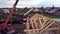 Top view of construction of wooden houses. Clip. Process of construction of country wooden house on background of