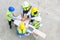 Top view of contractors, engineers and formats team in safety vests with helmets working with laptops, standing on under-