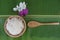Top view Cooked rice in bowl on green banana leaf and paddy in spoon and orchid .
