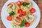 Top view of cooked Spaghetti with shrimps and cherry tomatoes