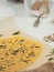 Top view, cookie dough with aromatic herbs, seeds and parmesan on a table. The process of making crackers. The concept of home