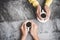 Top view with copy space. Couple in love holding hands with coffee love on table,