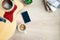 Top view of cosy home scene. Guitar, books, cup of coffee, phone and succulent plants over wooden background. Copy space, mock-up
