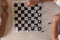 Top view of a couple of children in a school having a moment of recreation playing chess