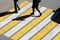 Top view of couple man and women people walk across crosswalk in the city street.