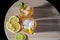 Top view of a couple of whisky glasses with lemon and lime garnish