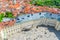 Top view of courtyard square of Prague Castle and Old Royal Palace with small figures of walking people tourists, red tiled roof