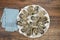 Top view of a covered oyster platter on a wooden table