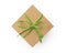 Top view of craft cardboard gift box with green recycled paper ribbon isolated on white