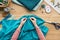 top view of cropped female hands sewing fabric with needle