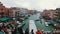 Top View of the crowd of people standing on the Rialto Bridge. Venice, Italy Grand Canal