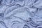 Top view crumpled light blue fabric texture background
