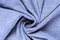 Top view of crumpled twisted blue fabric of cotton material background texture
