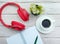 Top view Cup of black coffee, overhead music headphones with notepad with blank page for text. Desktop. Online education. Home