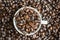 Top view of a cup filled with coffee beans