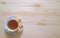 Top View of a Cup of Tea with Three Butter Cookies on the Wooden Table