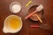 Top view of cupcake ingredients on a wooden table. cocoa, eggs, sugar in a bowl