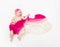 Top view of cute baby girl dressed in a fairy costume - fluttering long scarf and headband. Space for text